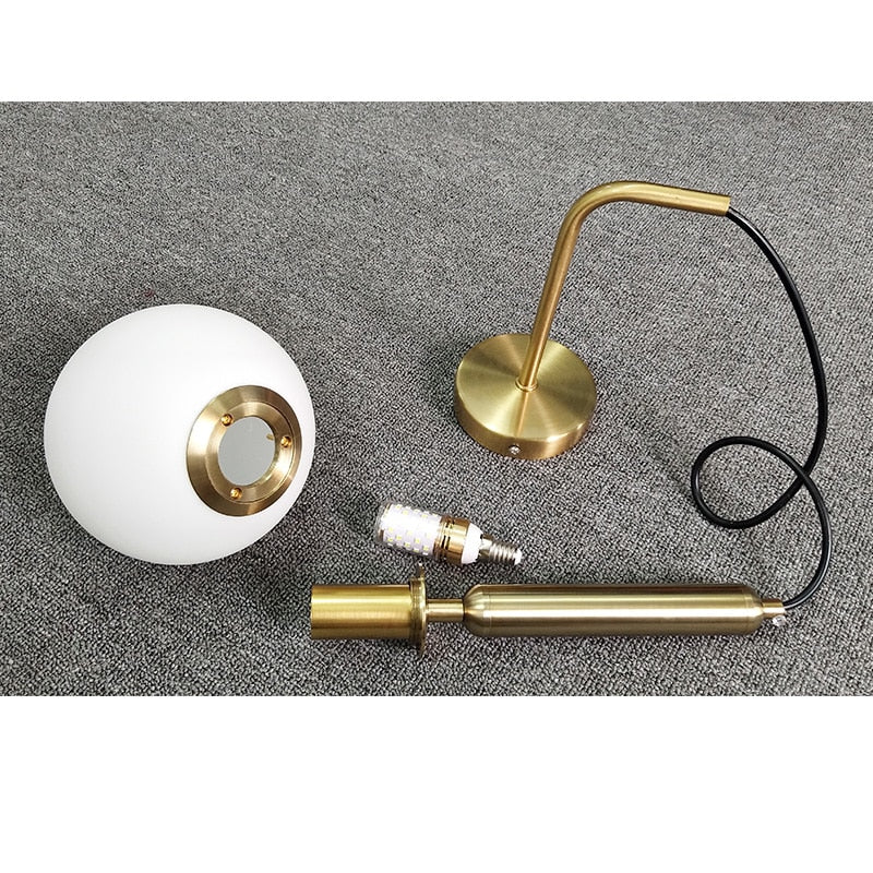 Élise Poiret Brass & Glass Globe Hanging Wall Lamp