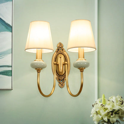 Marianne Gold Swoop Arm Wall Sconce with Cone Shade and Faux Jade