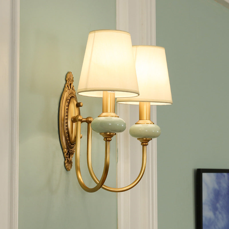 Marianne Gold Swoop Arm Wall Sconce with Cone Shade and Faux Jade