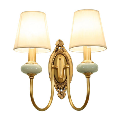 Marianne Gold Swoop Arm Wall Sconce with Cone Shade and Faux Jade