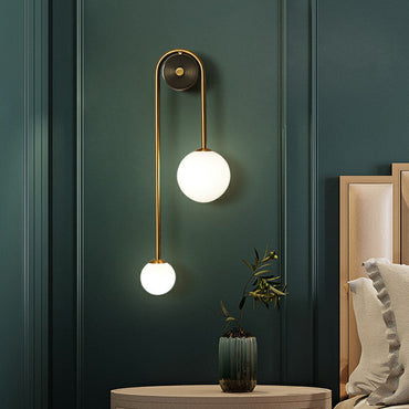 Élodie Brass Arc Wall Sconce with Opal Glass Shades