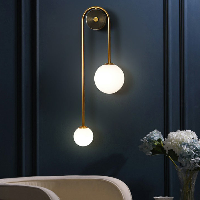 Élodie Brass Arc Wall Sconce with Opal Glass Shades