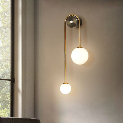 Élodie Brass Arc Wall Sconce with Opal Glass Shades