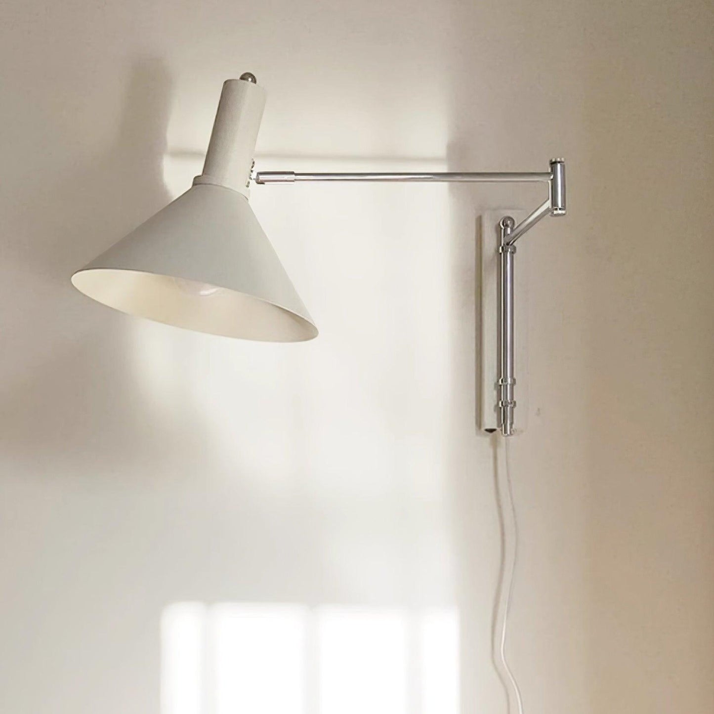 Céline Peak Plug-In Wall Lamp with Adjustable Swivel