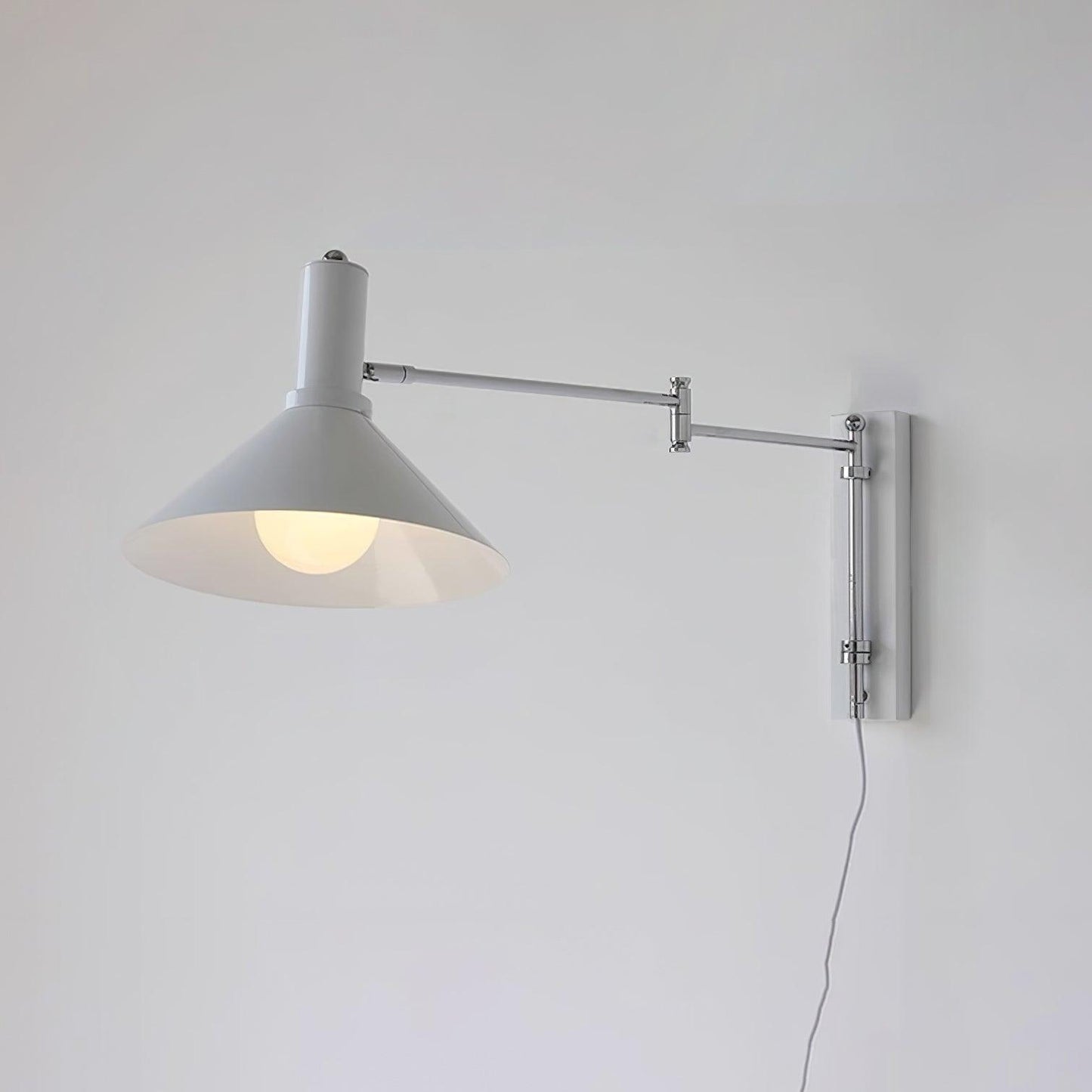 Céline Peak Plug-In Wall Lamp with Adjustable Swivel