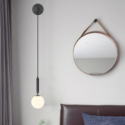 Élise Poiret Brass & Glass Globe Hanging Wall Lamp